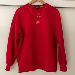 Red Nike street wear sweatshirt with gold embroidered necklaces